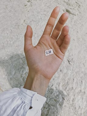 hand with a price tag